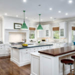 Island design of white kitchen in country style interior