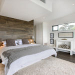 The decor of the bedroom is matte white and the laminate under a wood log