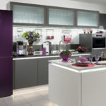 Refrigerator in the interior of the kitchen purple facade