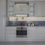 Gray palette of kitchen with beige walls