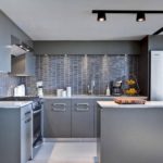 Gray kitchen palette with tile apron and countertops in gray granite