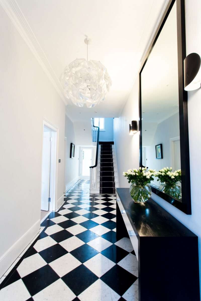 narrow hallway with a mirror