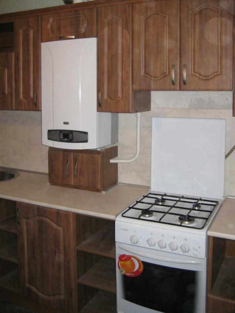 a idéia de um belo interior de cozinha com uma caldeira a gás