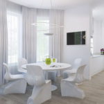 White kitchen with dining table near the window.