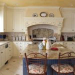 Provence style beige kitchen with island in the center