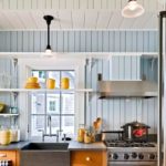 Yellow cups on open kitchen shelves