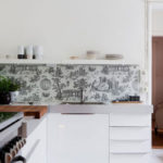 White shelf for dishes over the kitchen apron