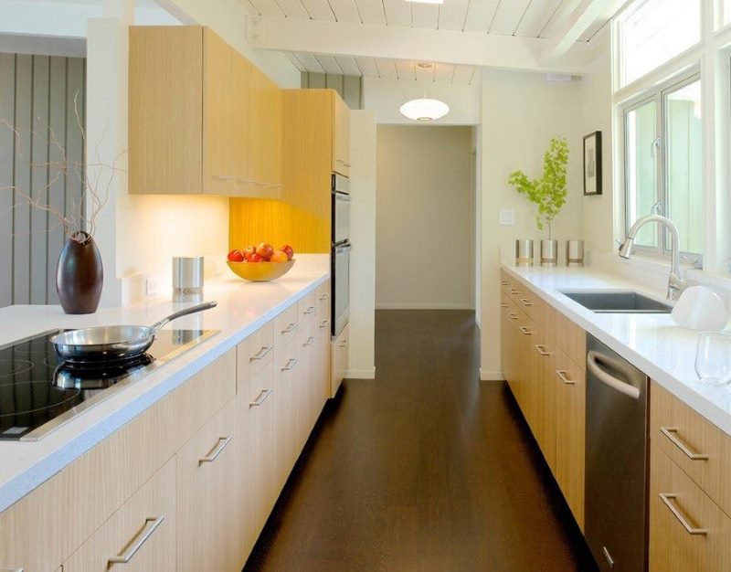 Walk-through kitchen with a sink at the window