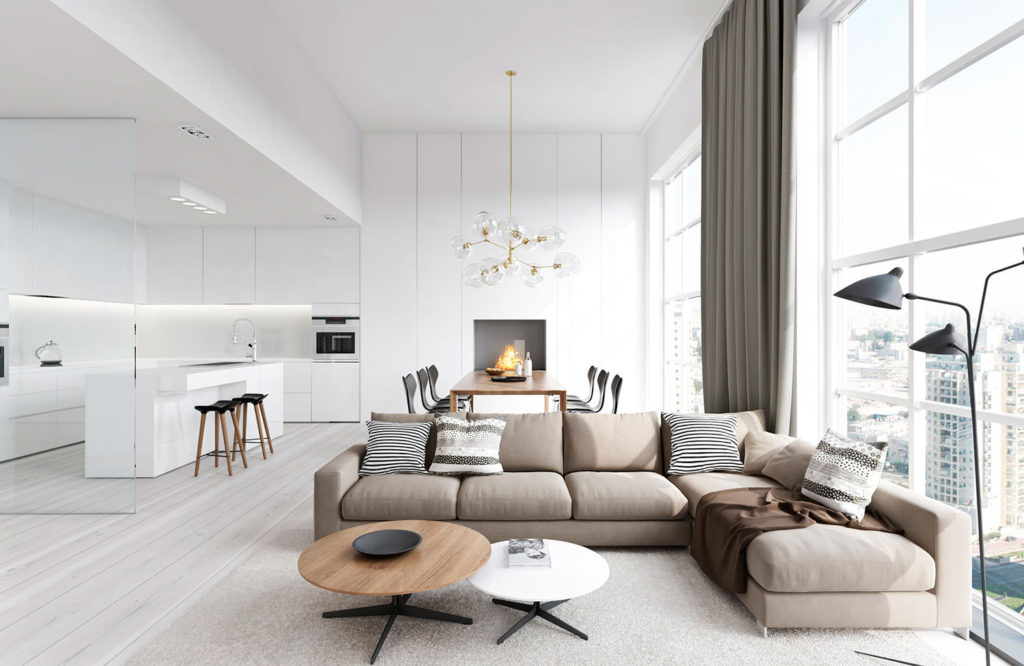 Sala-cozinha branca com sofá cinza