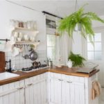 Wooden kitchen with a peninsula in a country house