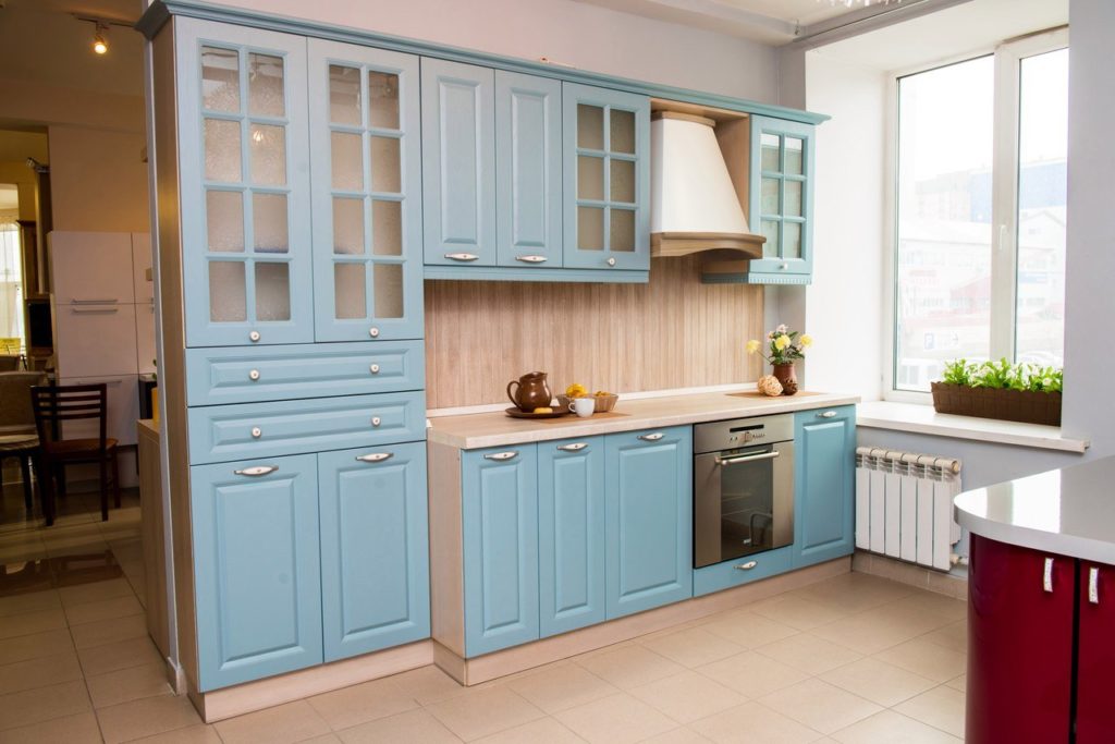Wooden facades of the kitchen light blue