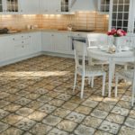Antique tiles on the floor of a Provence style kitchen