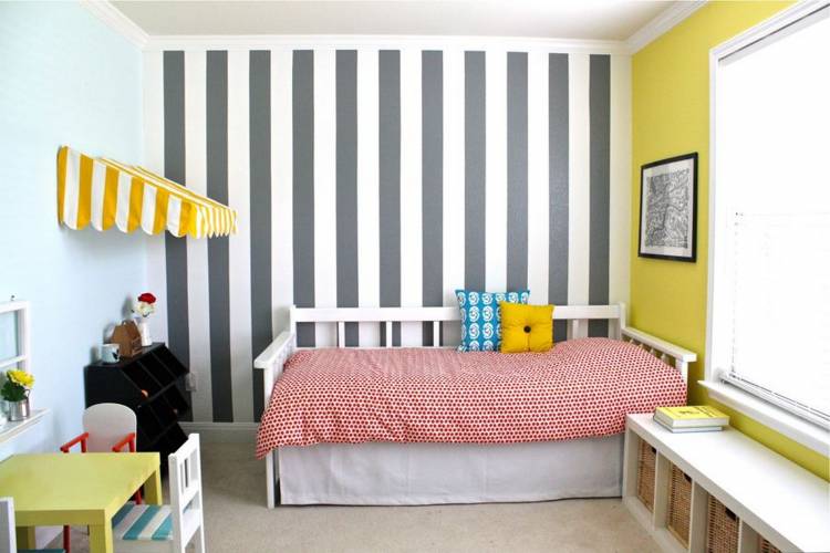 Striped wallpaper in the interior of a children's bedroom