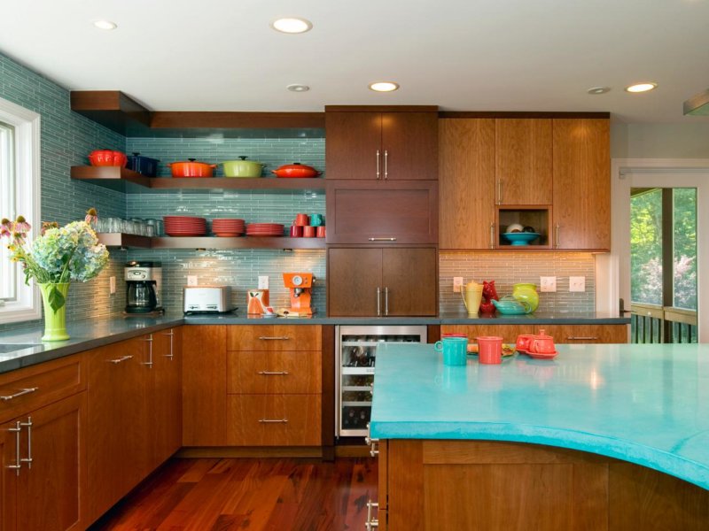 Turquoise countertop in the kitchen with wooden furniture