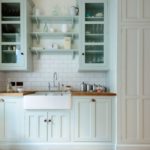 White sink in a linear kitchen