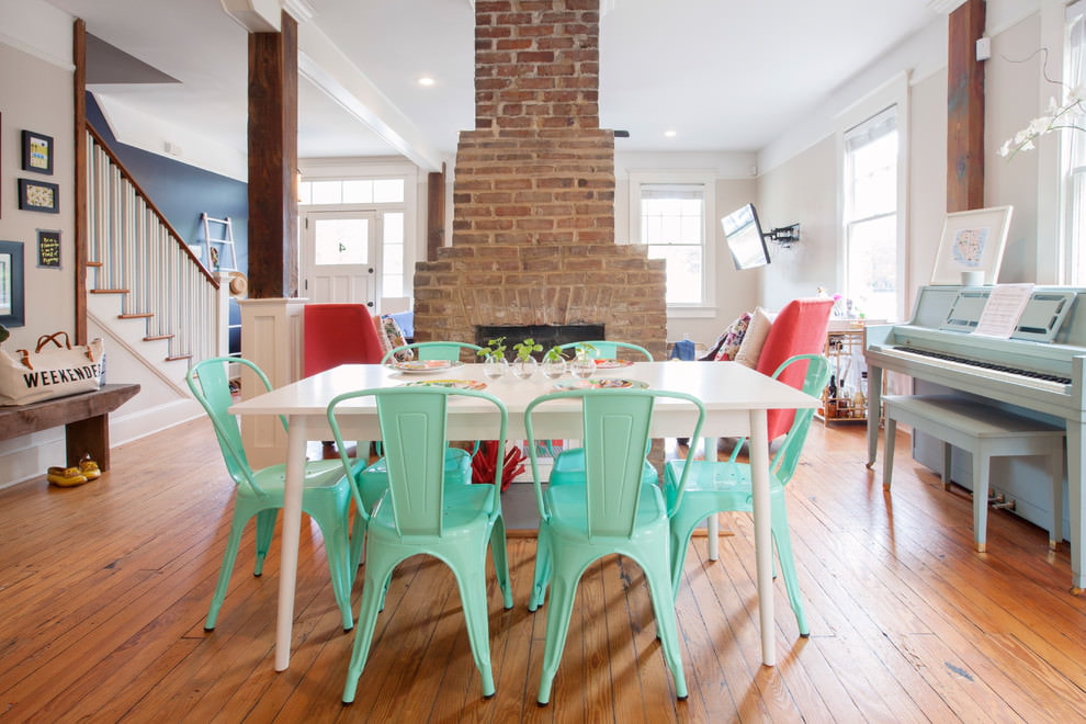 Mint-colored plastic chairs in the dining area of ​​the kitchen