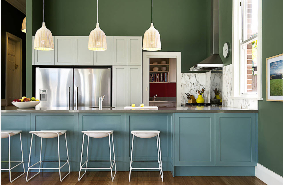 The dark mint fronts of the kitchen island
