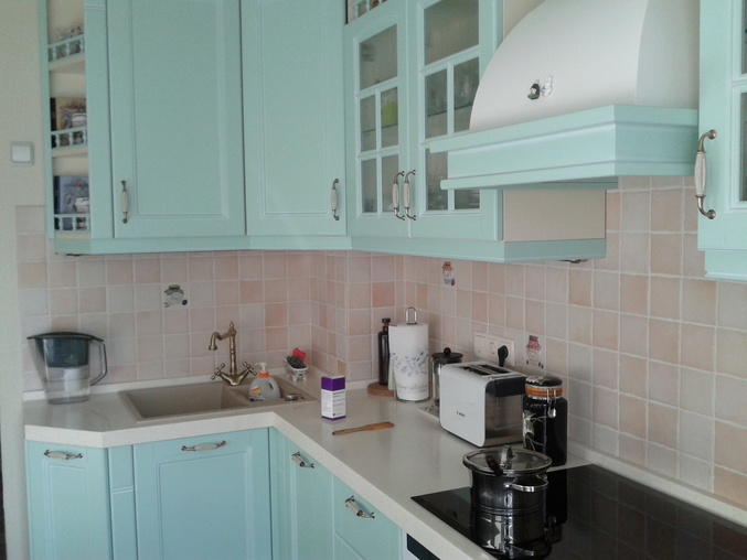 Mint kitchen with sink in the corner