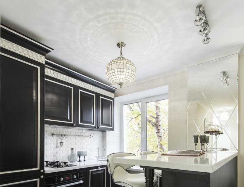 White kitchen ceiling with black furniture