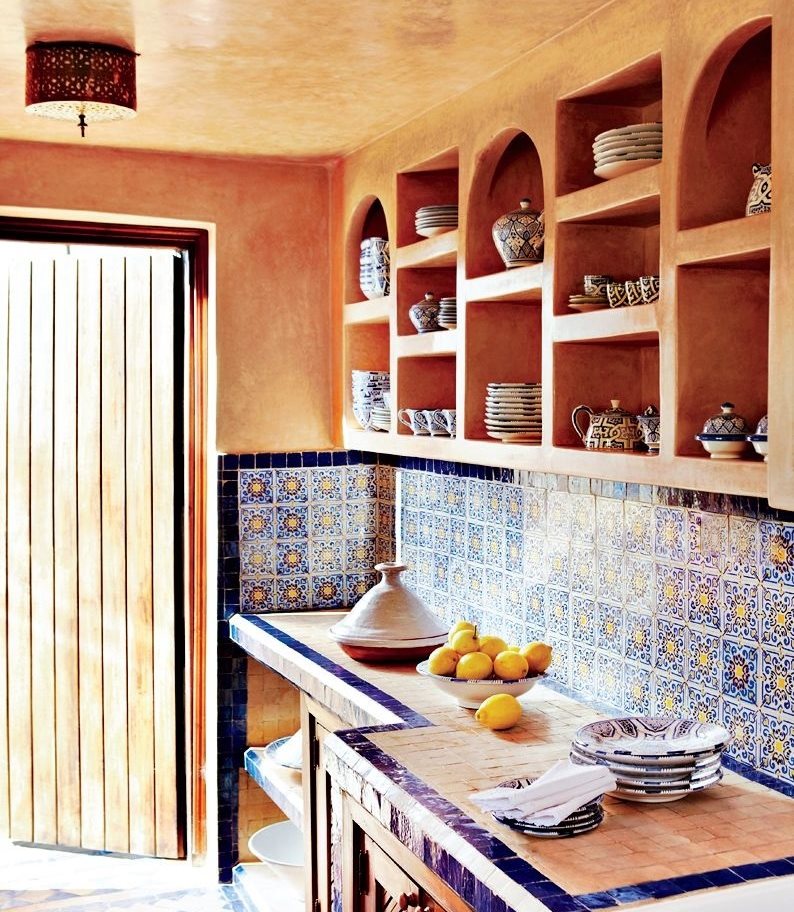Open shelves with dishes in the kitchen in ethnic style