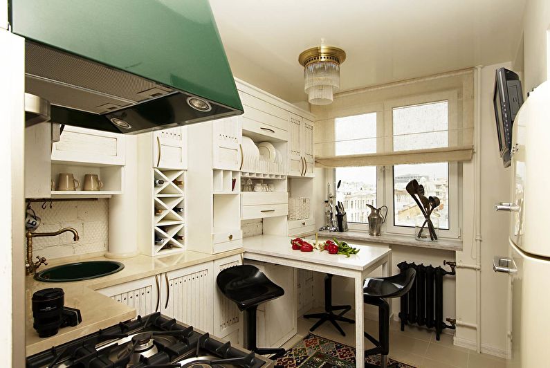 The interior of the kitchen area of ​​11 squares with a white suite