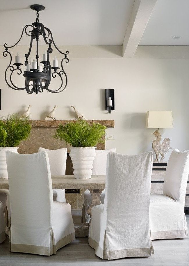White cotton covers on kitchen chairs
