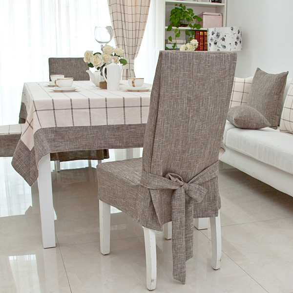 Gray cover made of natural linen on the back of the chair