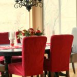 Red covers on kitchen chairs