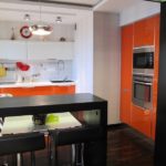 Orange color in the design of the kitchen