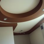 Brown and white ceiling in a small kitchen