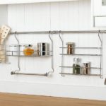 Hangers for storing dishes on the kitchen wall