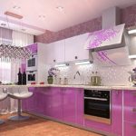 Design of a modern kitchen with pink furniture