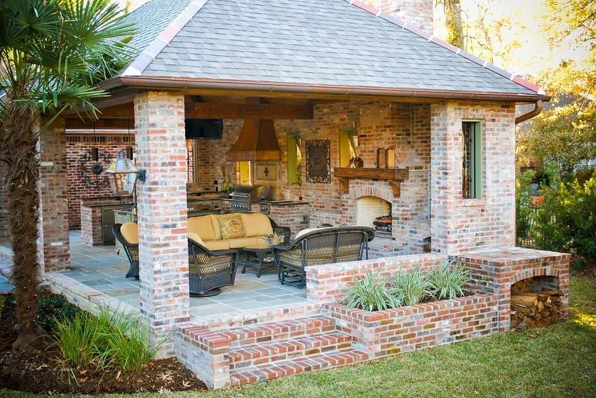 Brick summer kitchen with fireplace