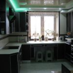 Dark suite in the kitchen of a panel house