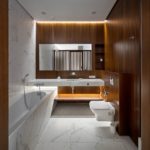 Marble bathroom with wood trim