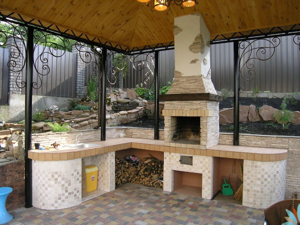 Brick barbecue in a summer kitchen without walls