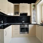Black apron in a compact kitchen