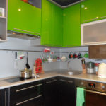 Green facades of wall cabinets