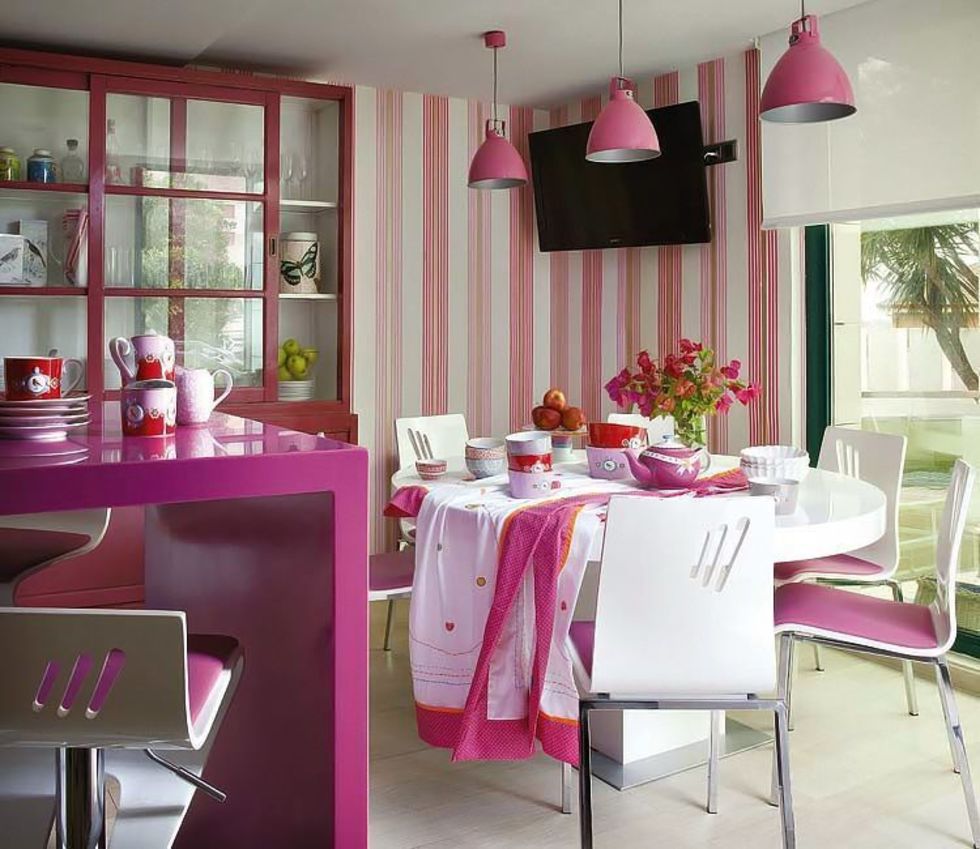Pink stripes on the wallpaper in the kitchen of a private house