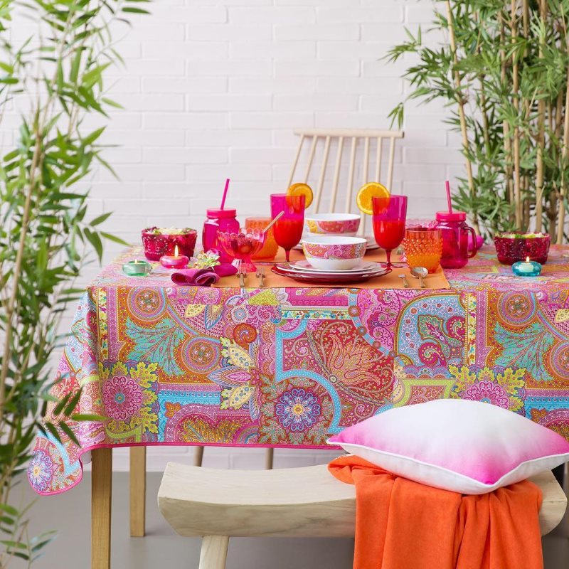 Kitchen table setting with a colorful tablecloth
