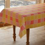Multi-colored squares on oilcloth tablecloth