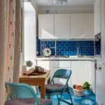 Corner kitchen with a blue apron