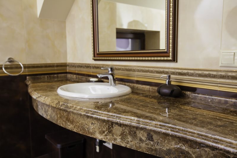 White sink in marble countertop