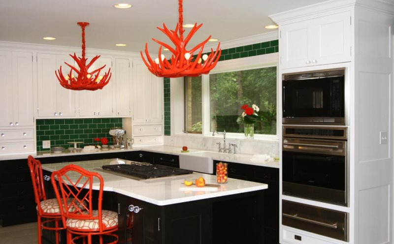 Accents of red in a black and white kitchen