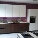 White cabinets on a purple wall