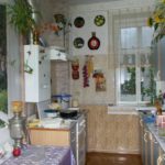 Narrow kitchen with photo wallpaper on the wall