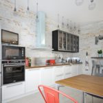 High ceiling bleached kitchen walls