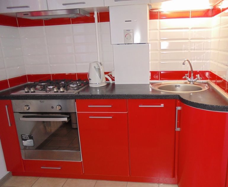 White gas water heater and red kitchen set