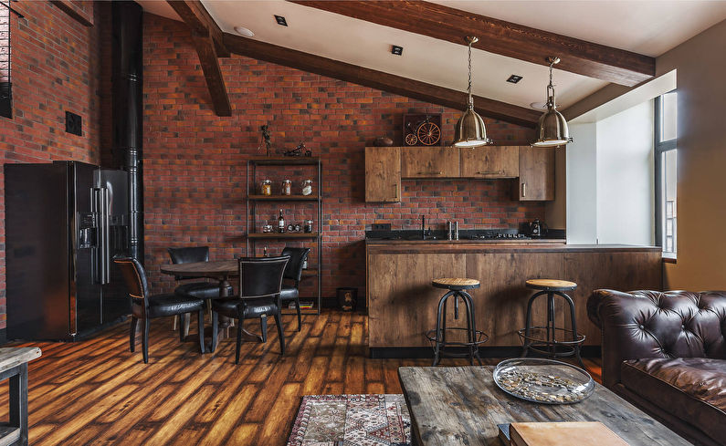 Wooden furniture in the loft-style kitchen-living room