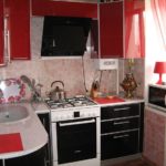 Red and black facades of a kitchen set